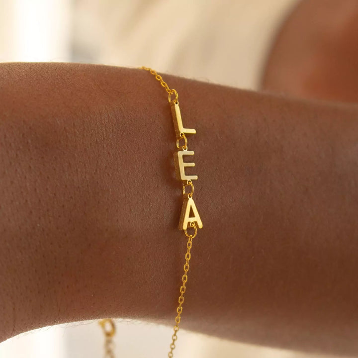 Golden Bond Name Bracelet, styled on the wrist