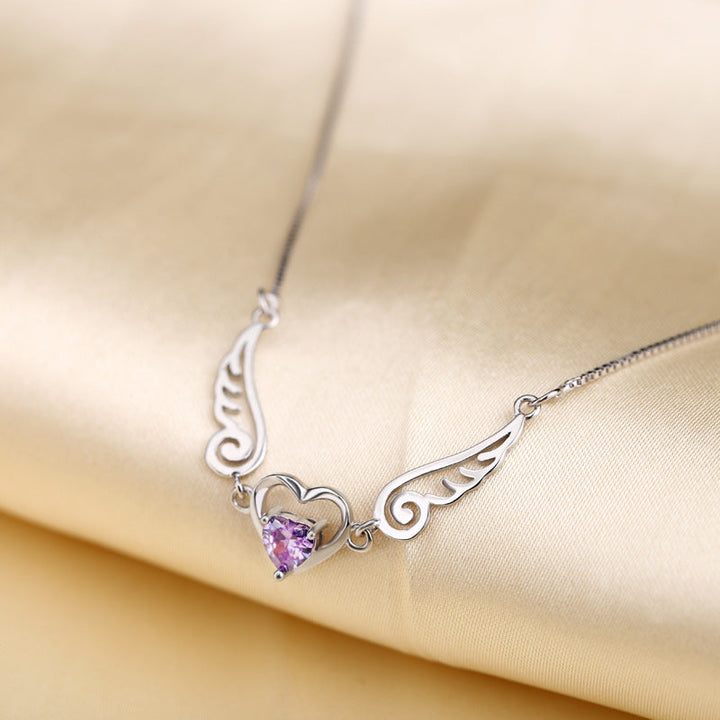 Angel Wings Necklace, worn at the neckline