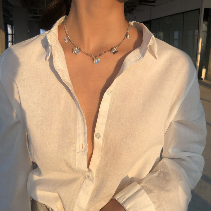 Butterfly Charm Necklace, worn at the neckline