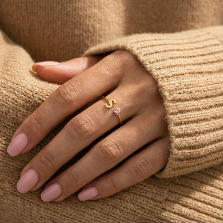 Bond Adjustable Initial and Birthstone Ring in gold, shown on the model