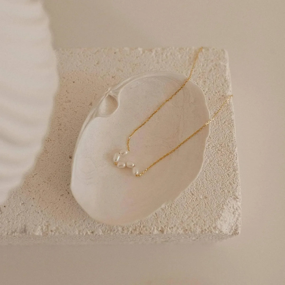 Pearl Light Necklace, shown on the model