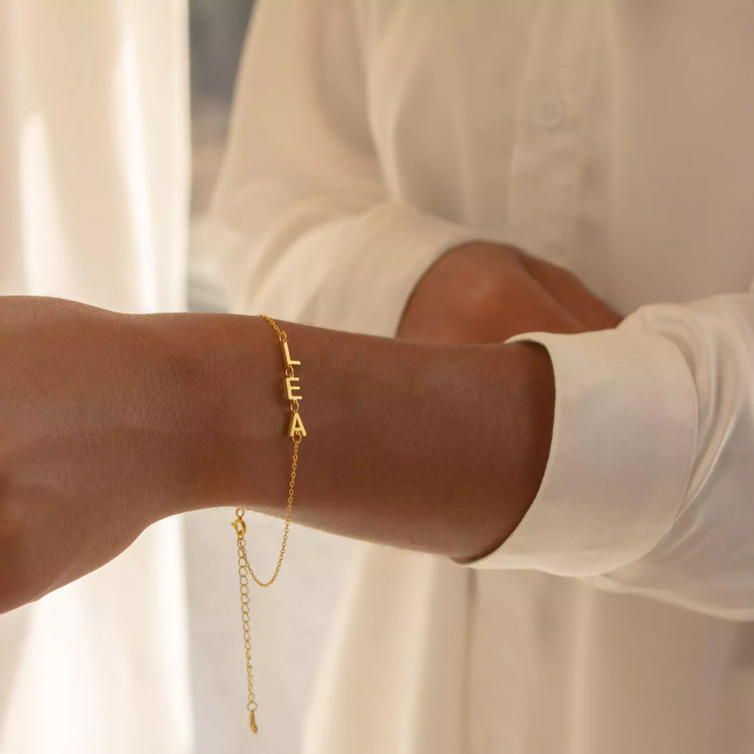 Golden Bond Name Bracelet, shown on the model