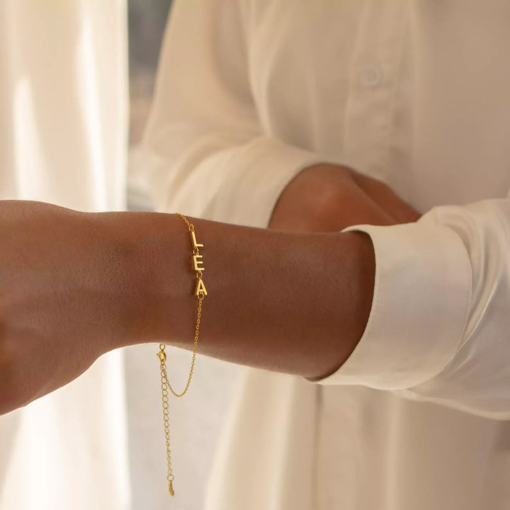 Golden Bond Name Bracelet, shown on the model