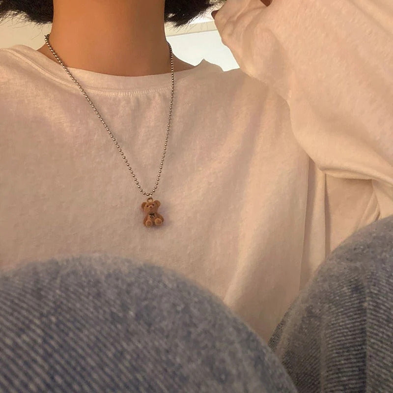 Plush Bear Necklace, close-up while worn