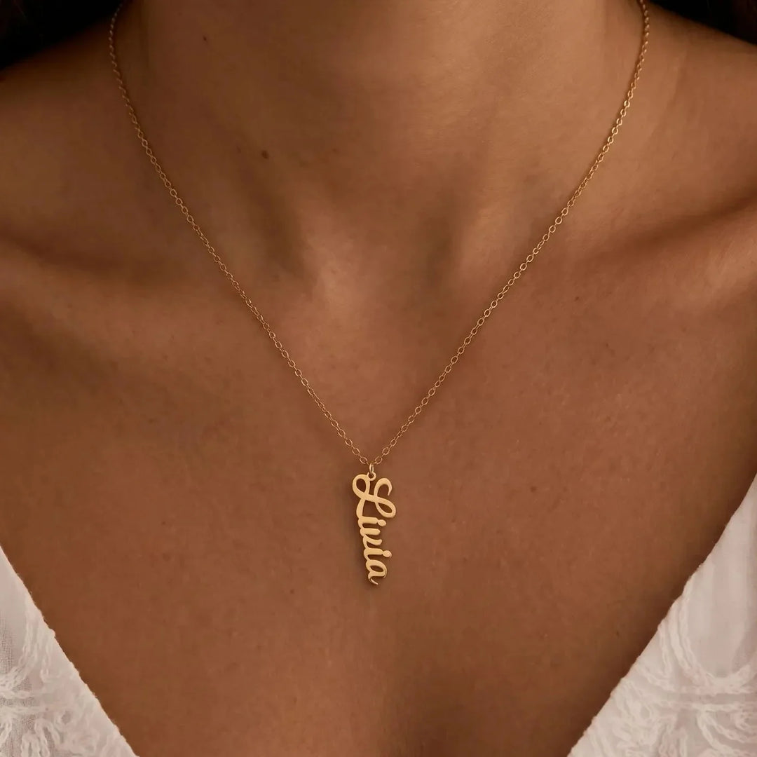 Liana Vertical Name Necklace, worn at the neckline