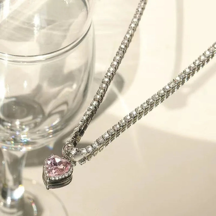 Pink Crystal Heart Pendant, close-up while worn