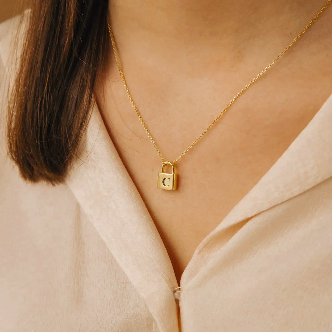Lucy Initial Necklace in gold, shown on the model