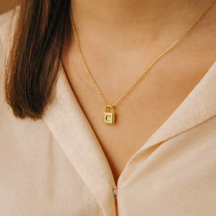 Lucy Initial Necklace in gold, shown on the model