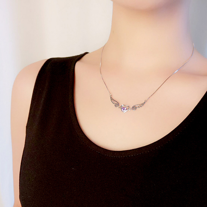 Angel Wings Necklace, shown on the model