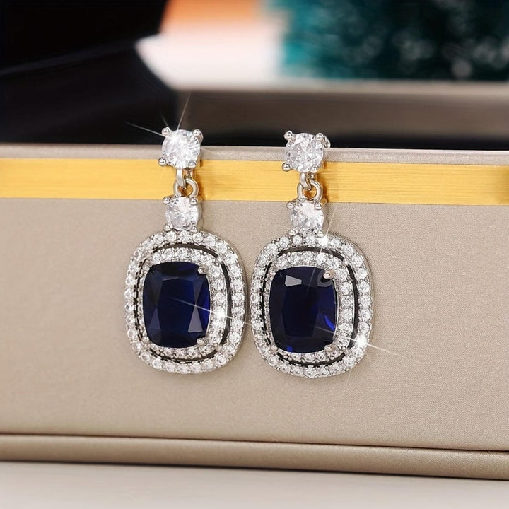 Oval Sapphire Earrings with Pavé Zirconia Accents