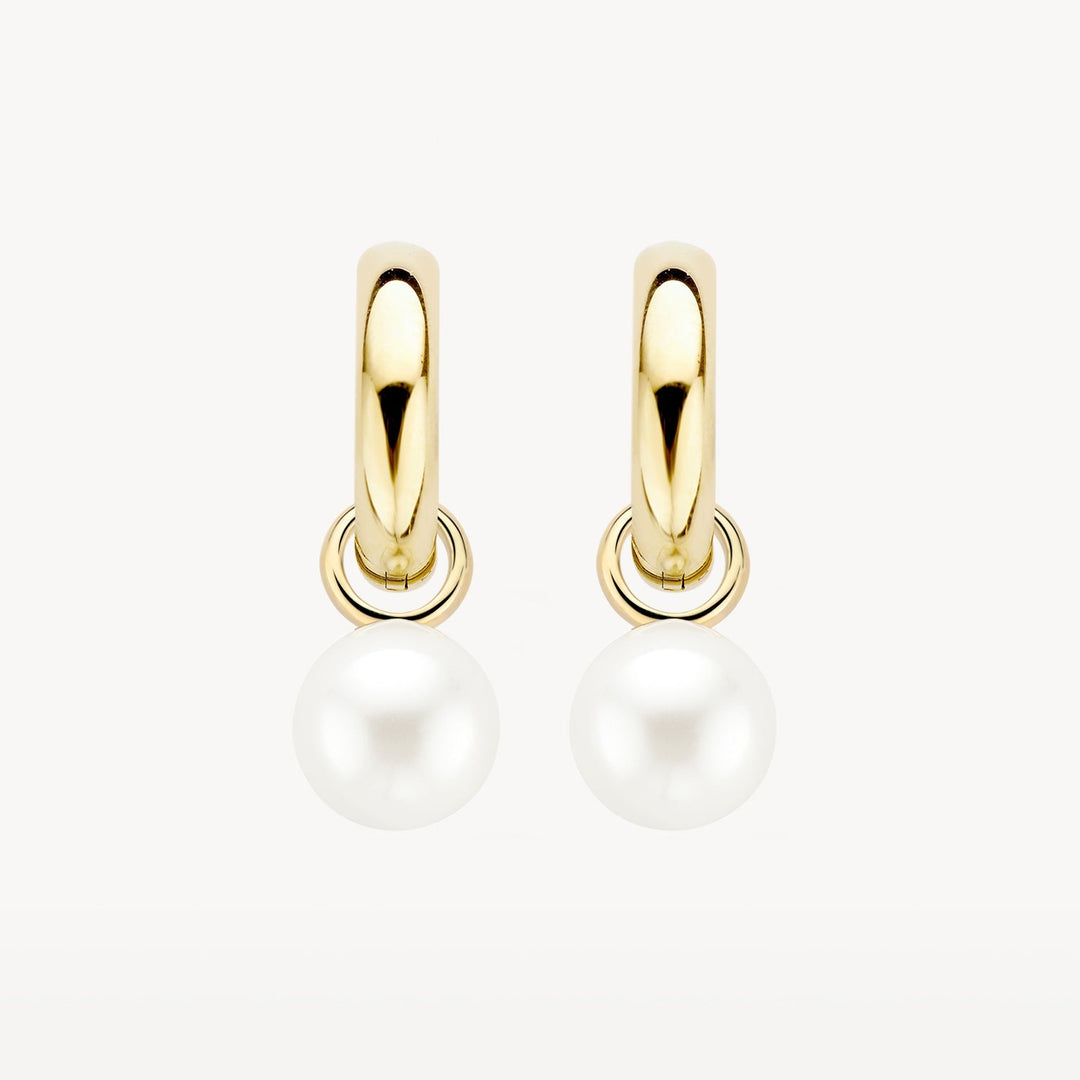 Livia Pearl Earrings in gold, shown on a plain background