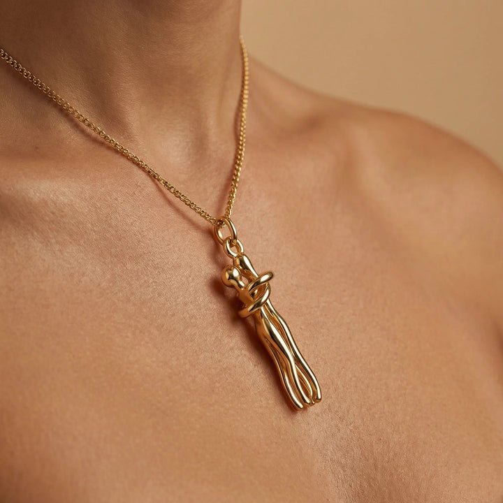 Loves Embrace Necklace, shown on the model