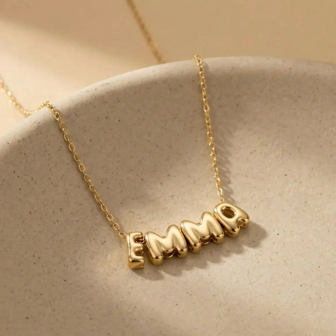 Lovia Balloon Letter Necklace, shown on the model