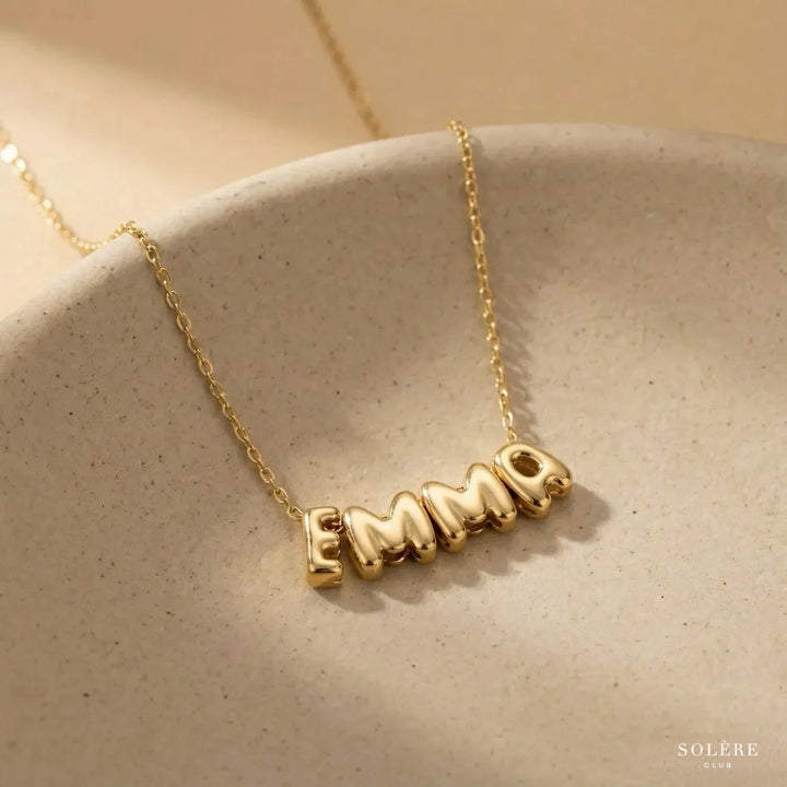 Elvira Balloon Letter Necklace, shown on the model
