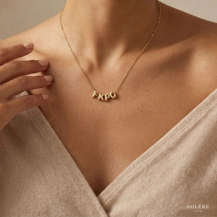 Elvira Balloon Letter Necklace, worn at the neckline
