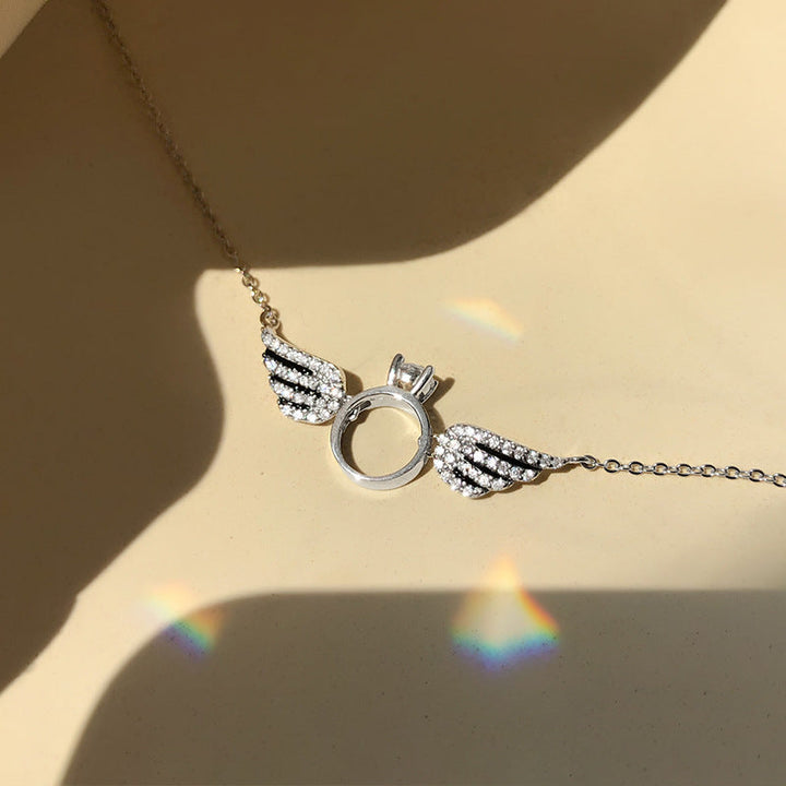 Angel Wings Ring Necklace, close-up while worn