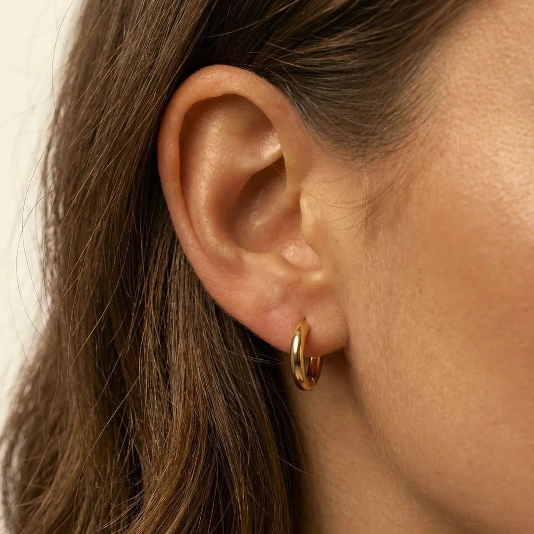 Abia Stud Earrings, worn on the ear