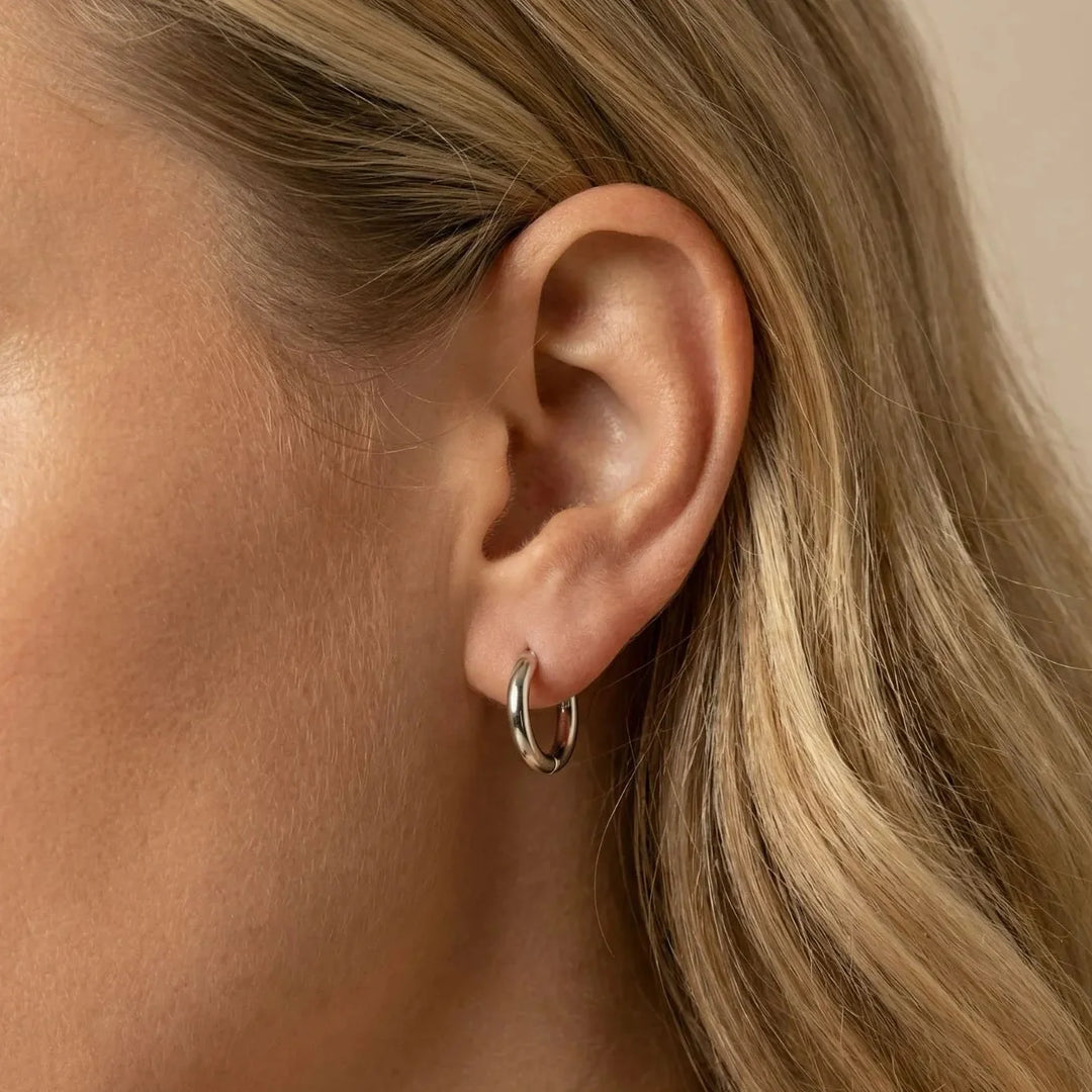 Abia Stud Earrings, close-up on the ear