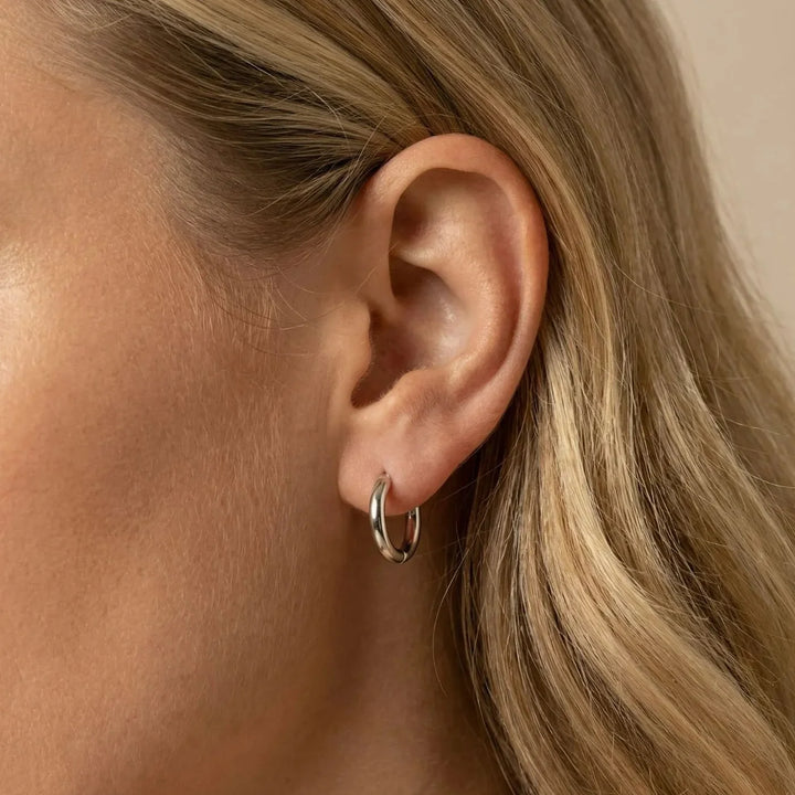 Abia Stud Earrings, close-up on the ear