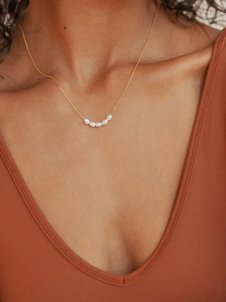 Pearl Light Necklace, worn at the neckline