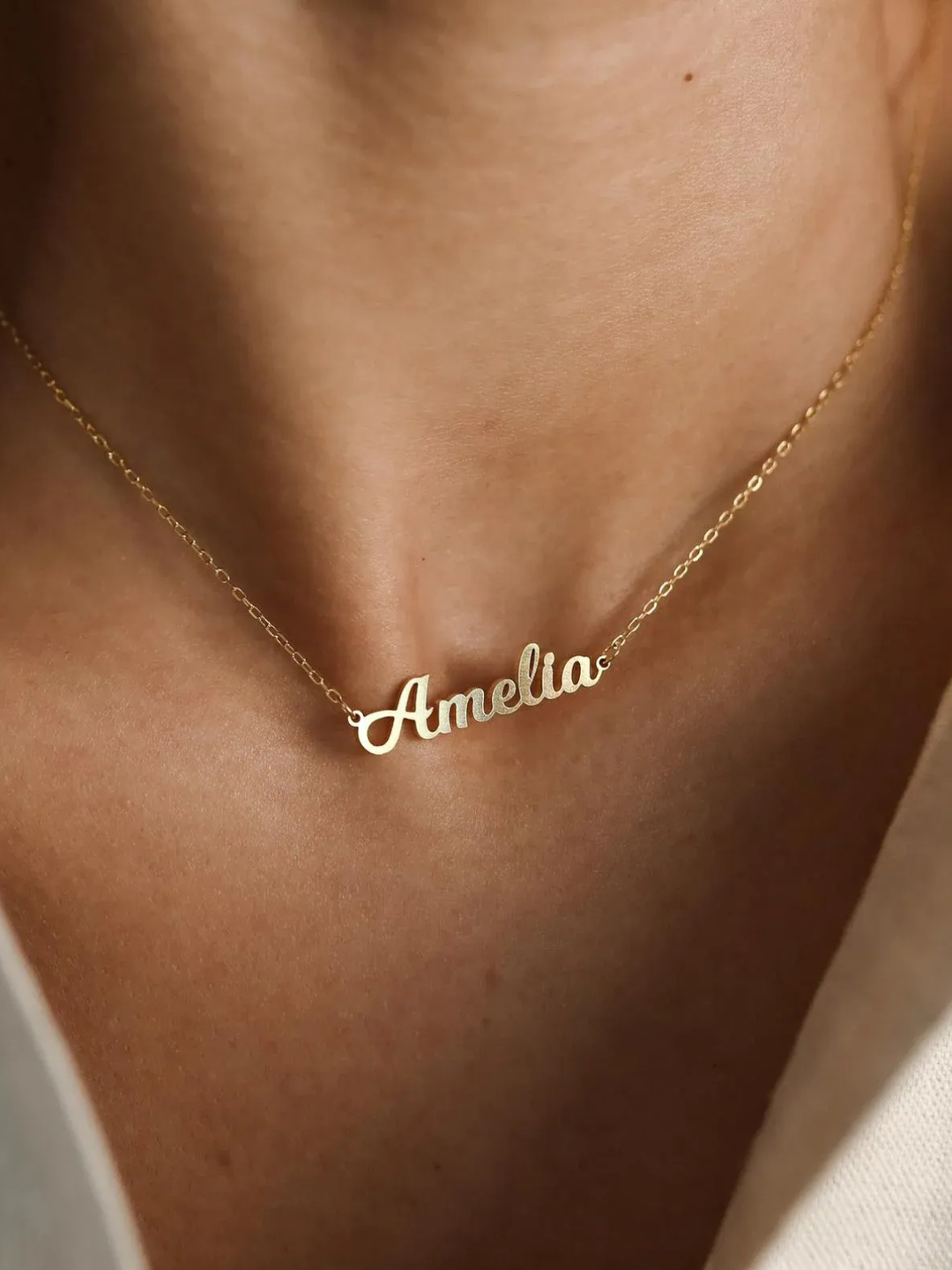 Firma Name Necklace, worn at the neckline