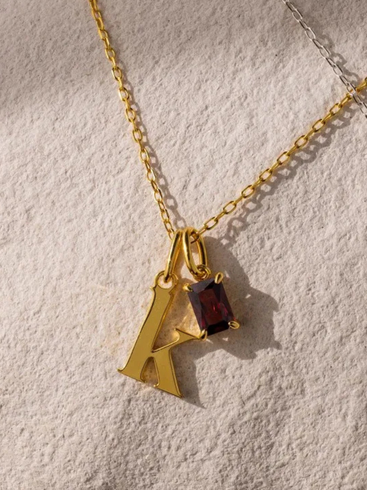 Signature Birthstone Necklace in gold, worn at the neckline