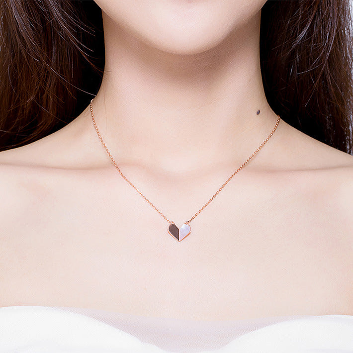 Origami Heart Necklace, shown on the model