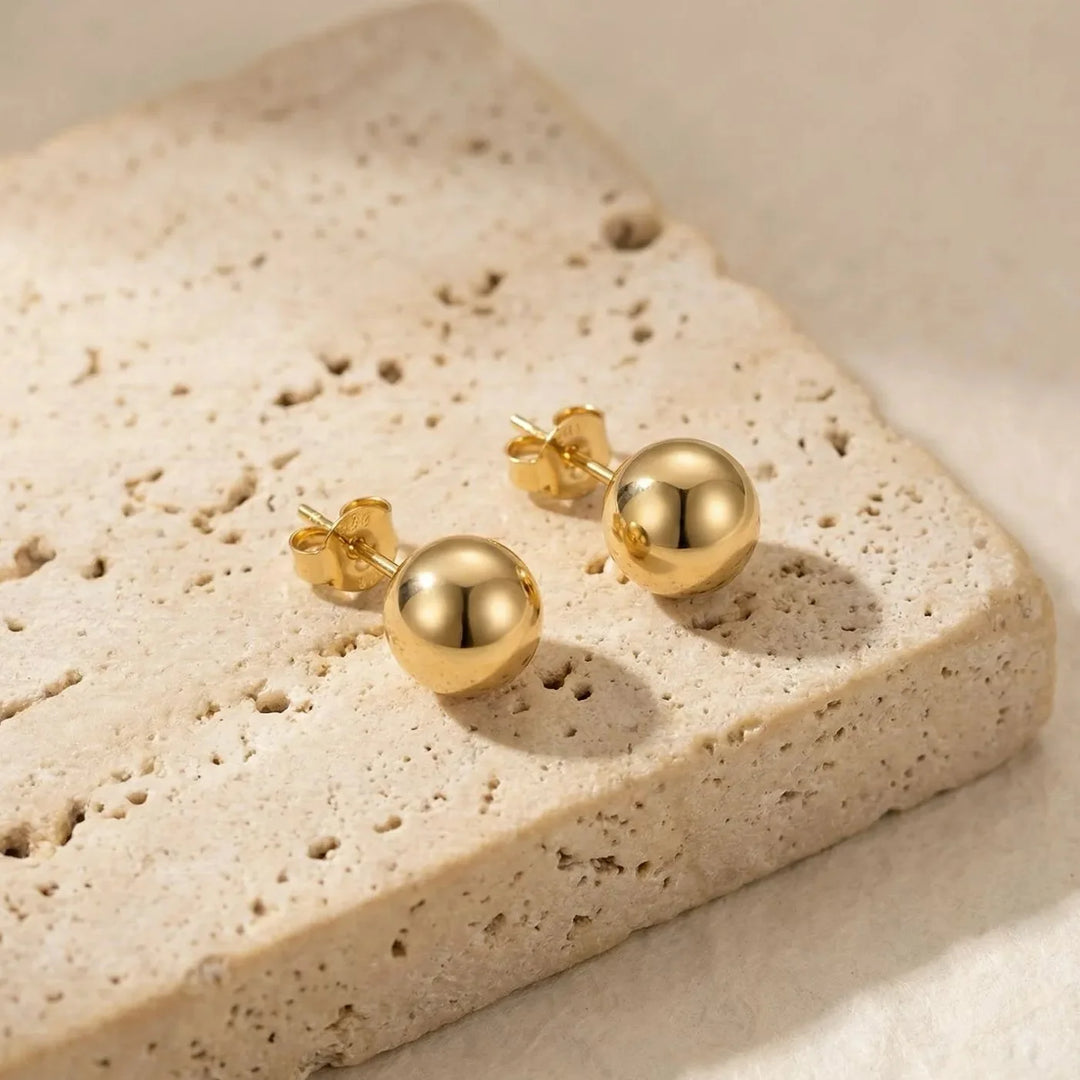 Evia Earrings, worn on the ear
