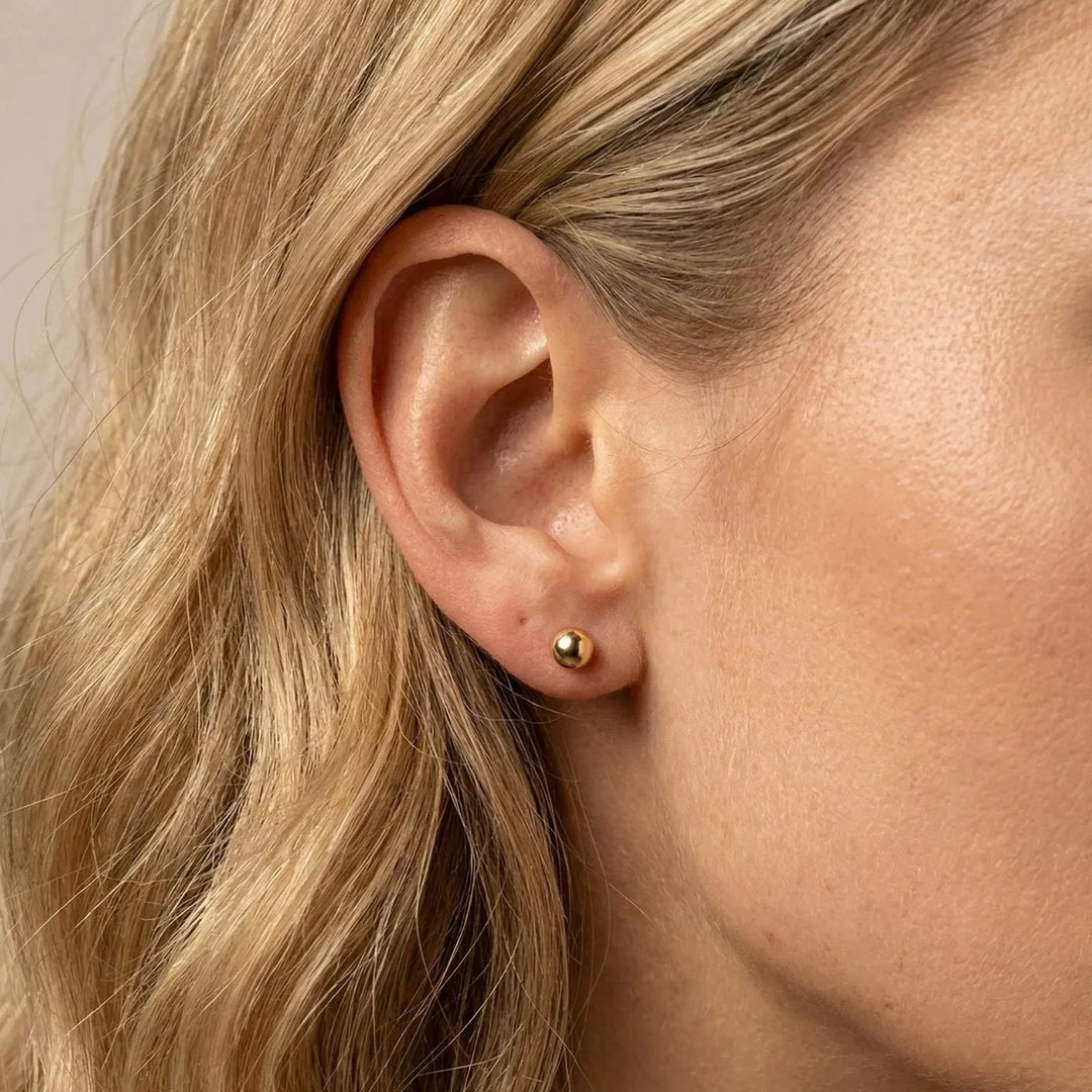 Evia Earrings, shown on the model
