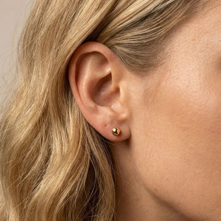 Evia Earrings, shown on the model