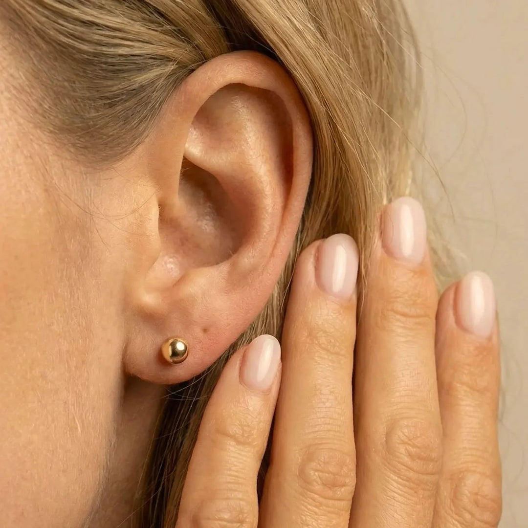 Evia Earrings, styled on the model