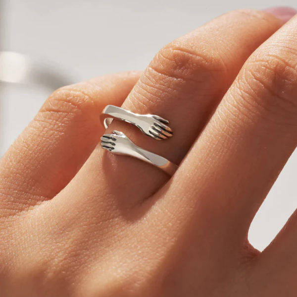 Eternal Embrace Adjustable Ring, shown on the model