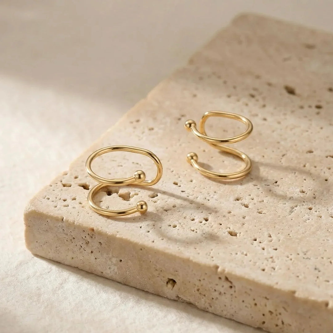Caline Earrings, shown on the model