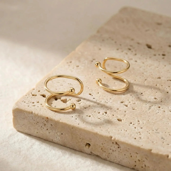 Caline Earrings, shown on the model