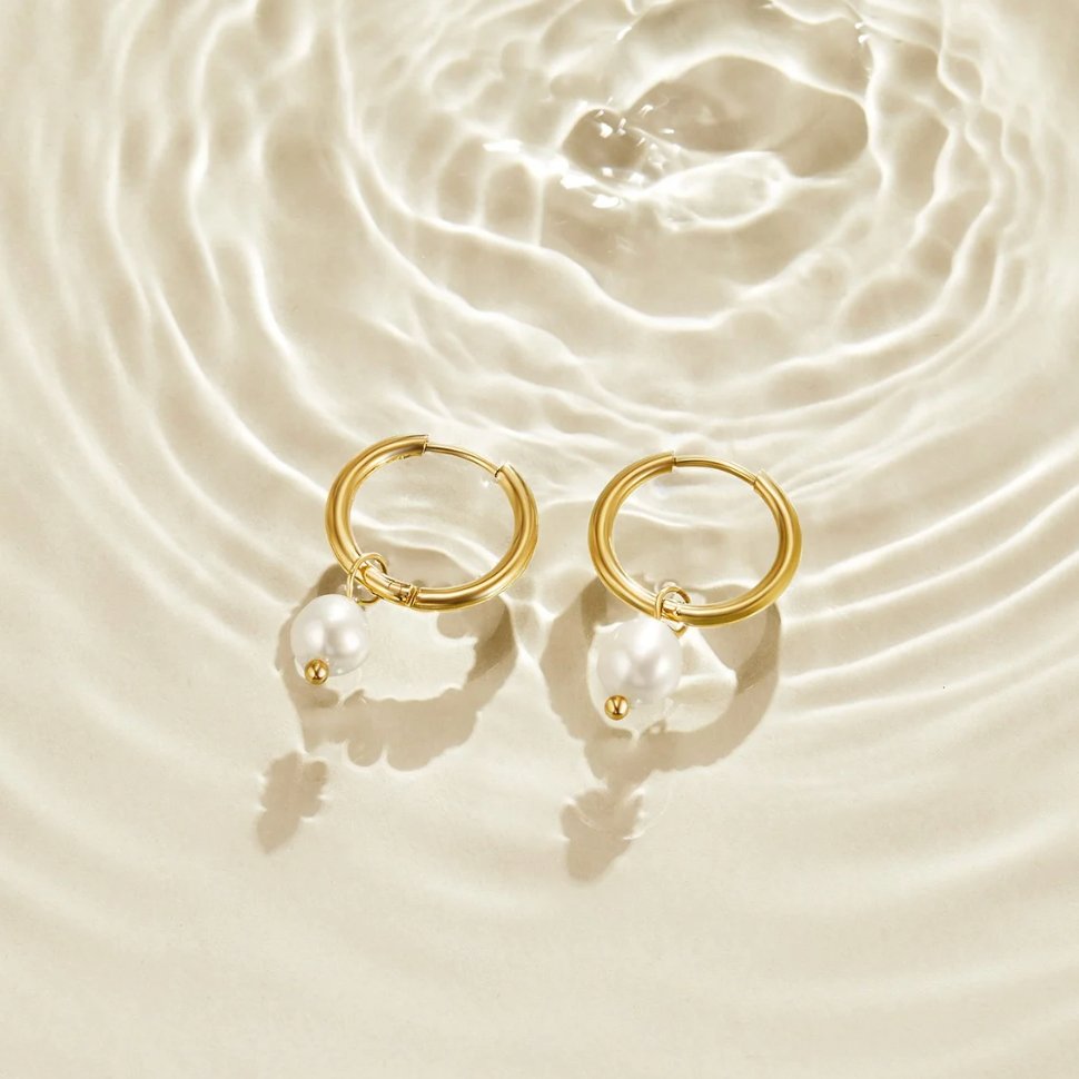 Maia Earrings, shown on the model 2