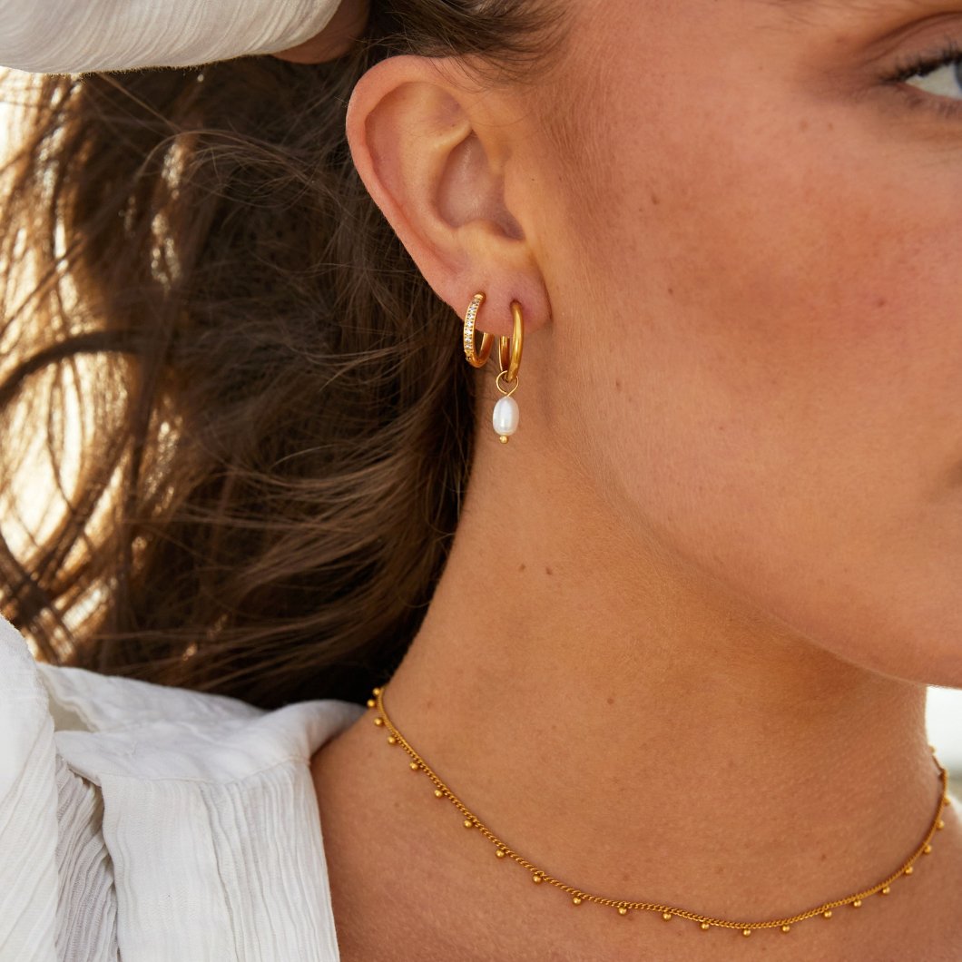 Maia Earrings, worn on the ear