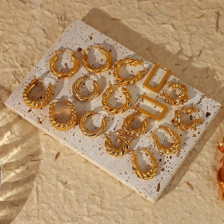 Alana Braided Earrings in gold, worn on the ear 2