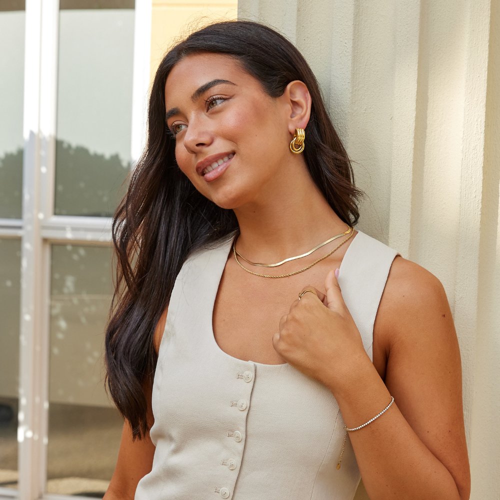 Cenya Earrings, styled on the model