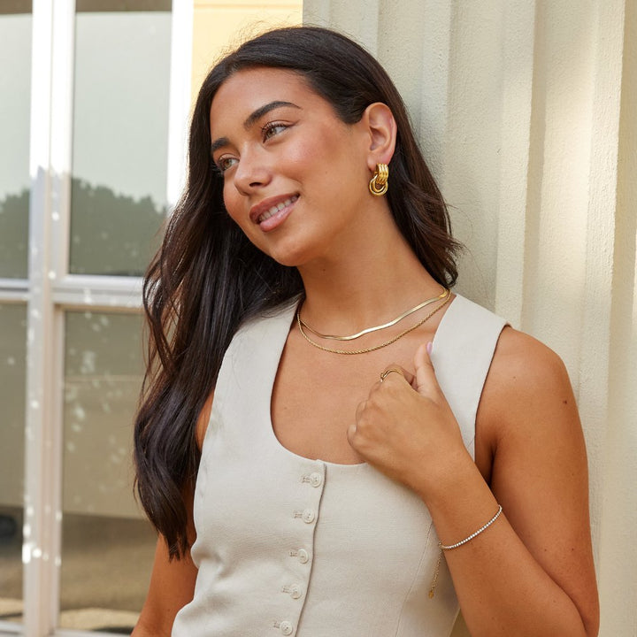 Cenya Earrings, styled on the model