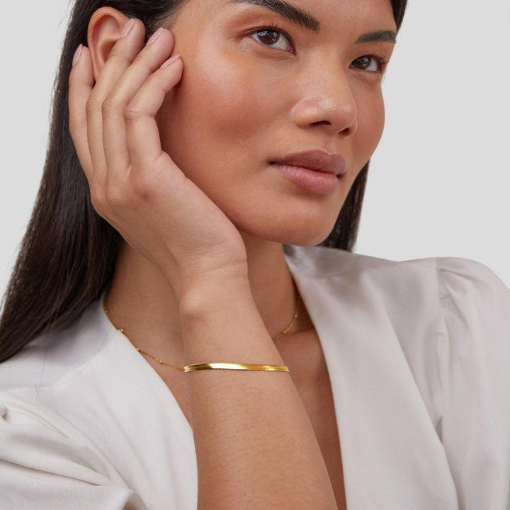 Amy Bracelet in gold, shown on the model