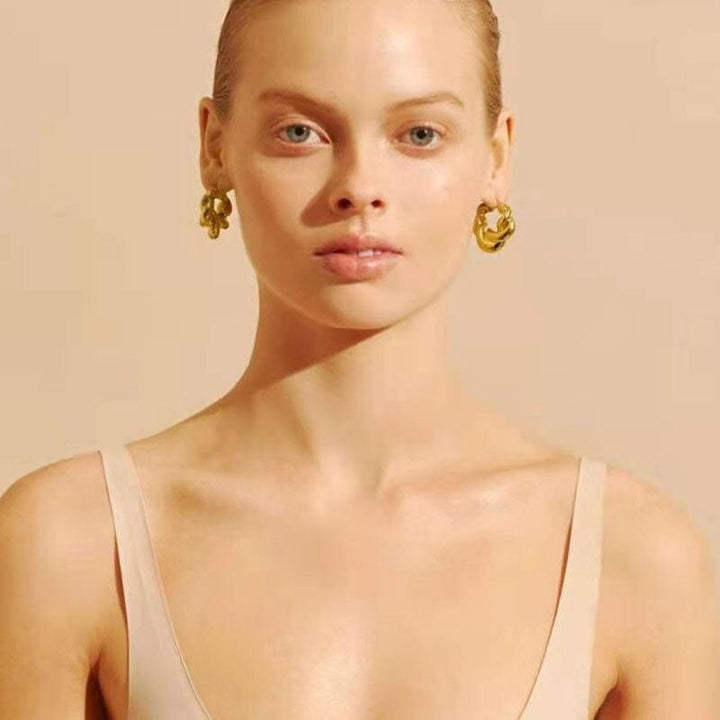 Alana Braided Earrings in gold, worn, side view