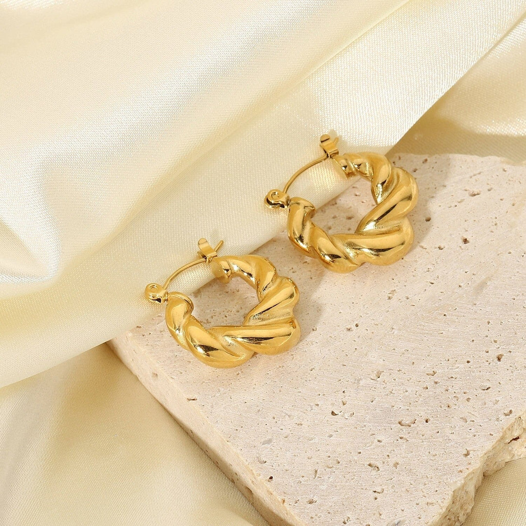 Alana Braided Earrings in gold, shown on the model