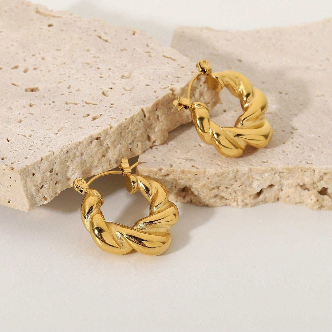 Alana Braided Earrings in gold, styled on the model